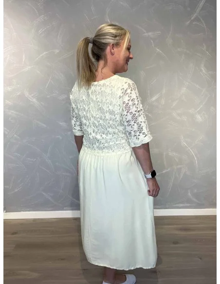 Bagside af gul kjole med blonde overdel – TIPPY
