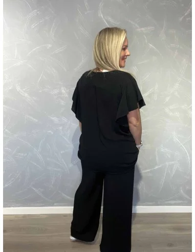 Bagside af sort sæt med bluse og bukser – TIPPY