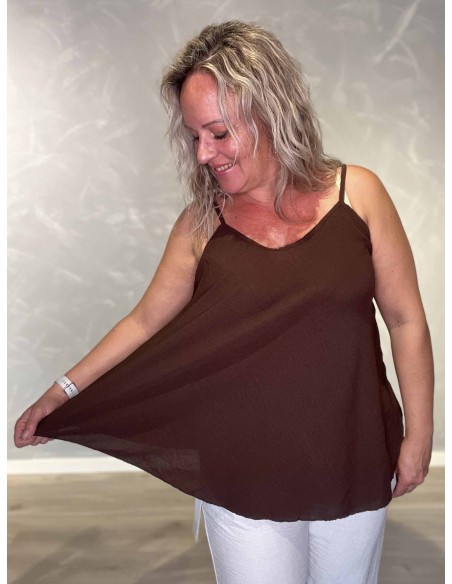 Nærbillede af a facon på polyester og elastan top – TIPPY