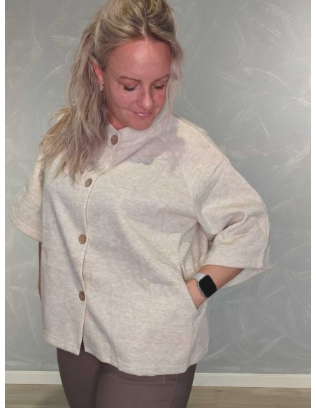 Nærbillede af lommer på beige cardigan i polyester og viskose – TIPPY