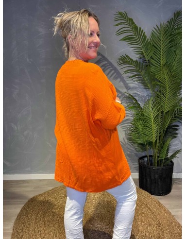 Orange oversize tunika med broderi anglaise detaljer, 3/4 ærmer og rund hals, bagfra